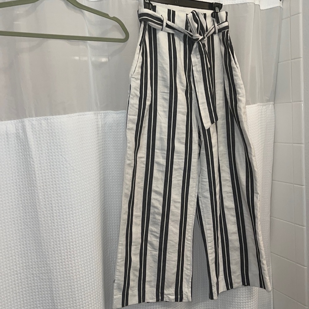 High waisted, wide legged trousers